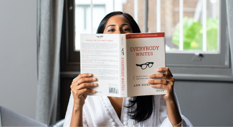 Nikita Morell with a book, Everybody Writes by Ann Handley 